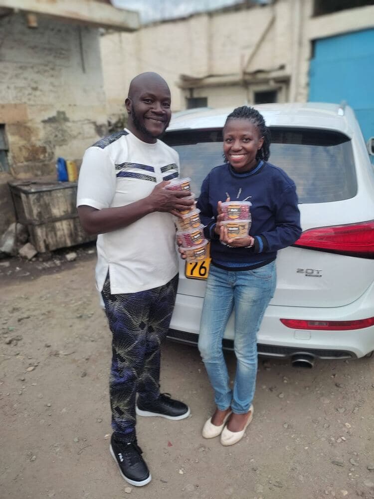 Handing over an order of nut butter to a customer
