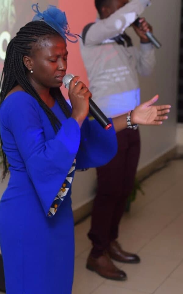 Gloria speaking at an event